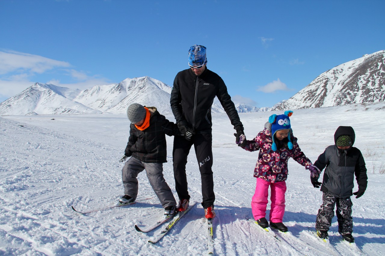 SkiKu program director Lars Flora teaching a group of students to side step up steep hills.