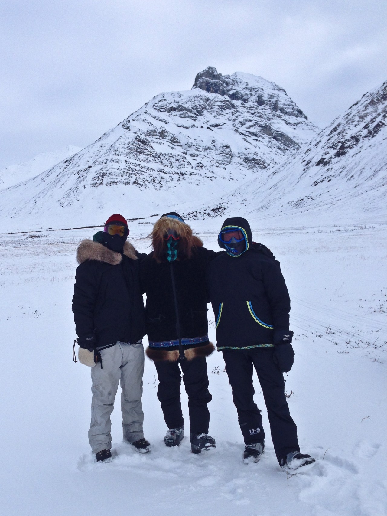 Snow machines  are the best way to get around.  Here we're on our way back to town.  When snowmachining in the Arctic, the name of the game is no exposed skin.  From left to right: Brooks, myself, and Lars.